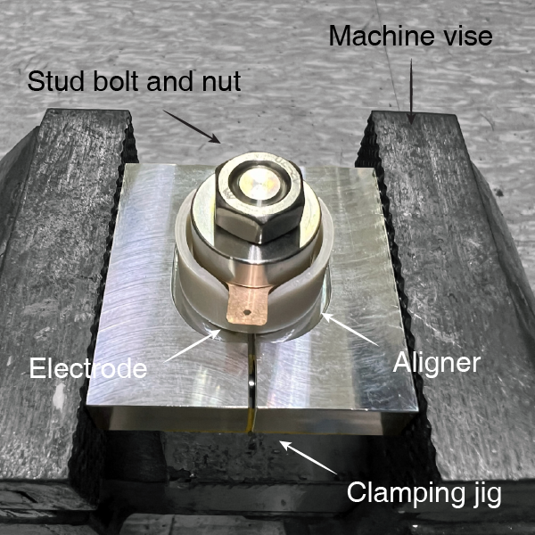 MiPAL Langevin-type transducer assembly using machine vise, custom clamping jig, and aligner