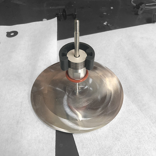First piezoelectric stack and electrode aligned by assembly jig