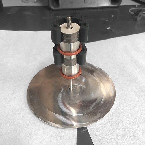 Second piezoelectric stack and electrode aligned by assembly jig