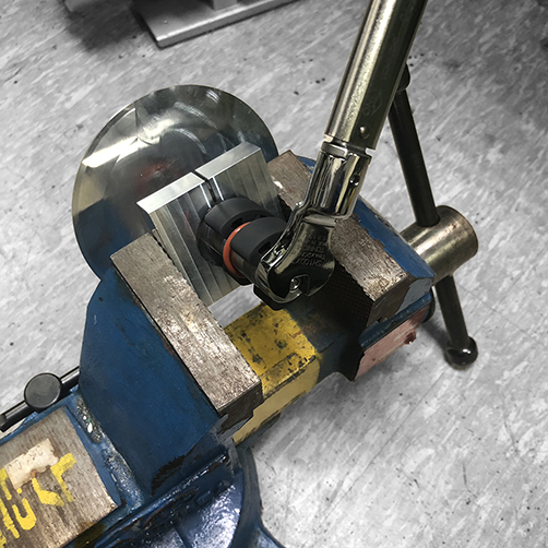 Tightening transducer assembly with torque wrench for controlled preload